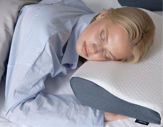 Derilla Memory Foam Pillow shown in a side-sleeping context